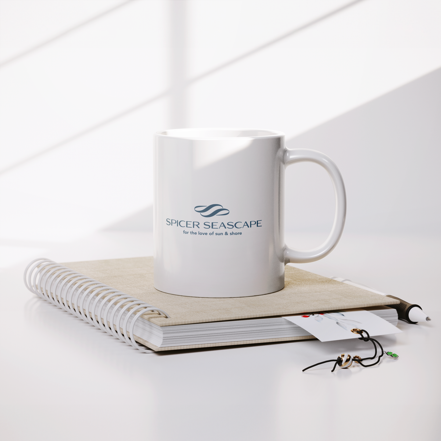 Coffee_Mug_11oz_with_Logo_Lifestyle_Notebook_Mockup.png_15784298